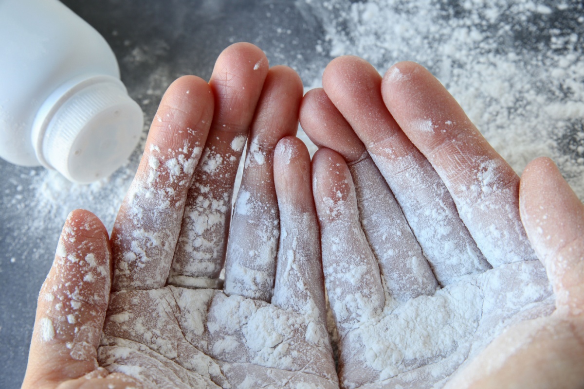 Hands covered in Talcum Powder - representing the risk of Mesothelioma