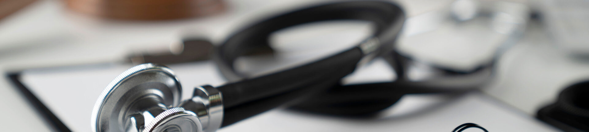 A stethoscope on a desk, highlighting the medical profession related to malpractice cases at Slater and Zurz.
